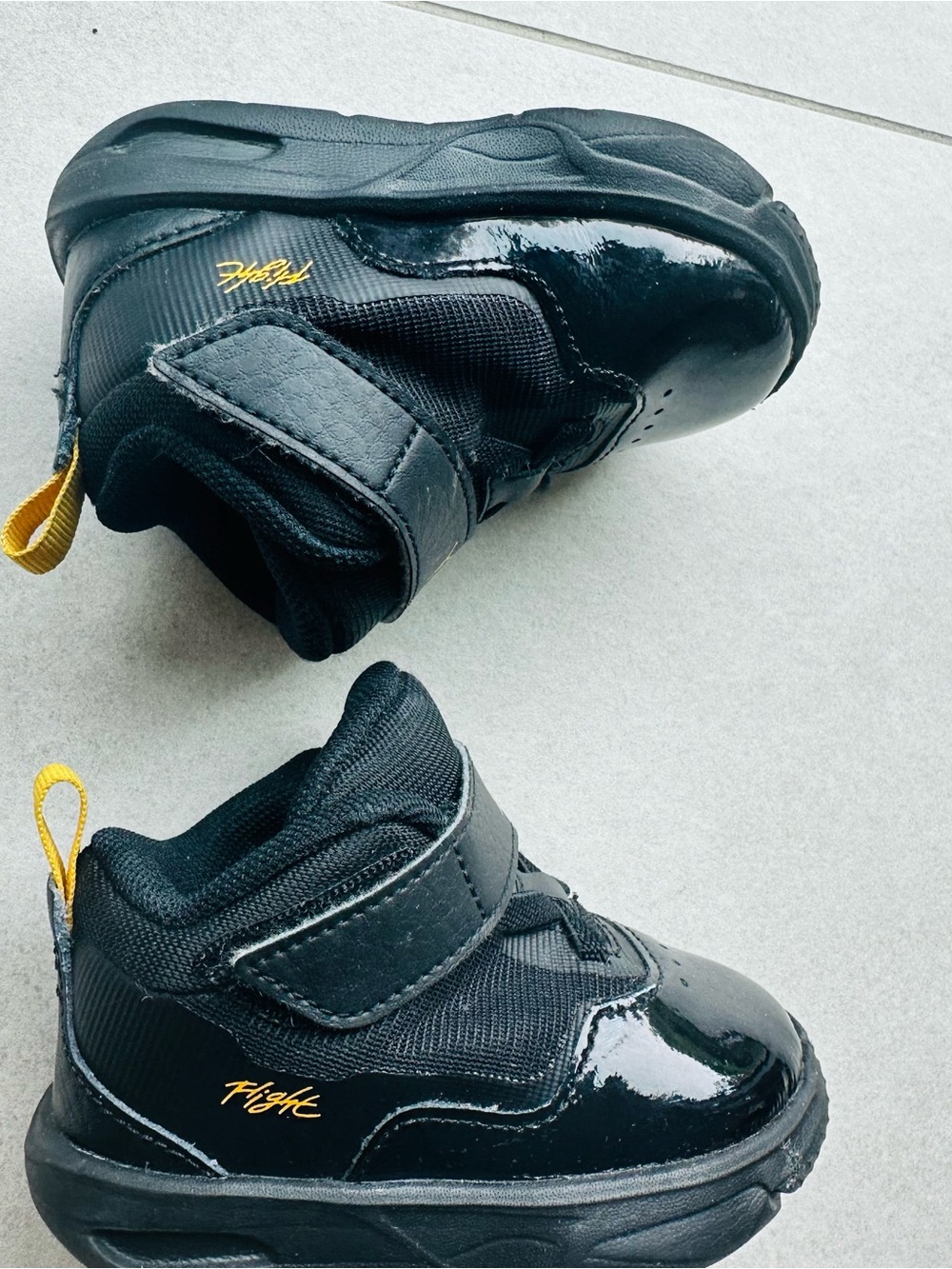 Jordan Kids Black High-Top Sneakers with Yellow Accents